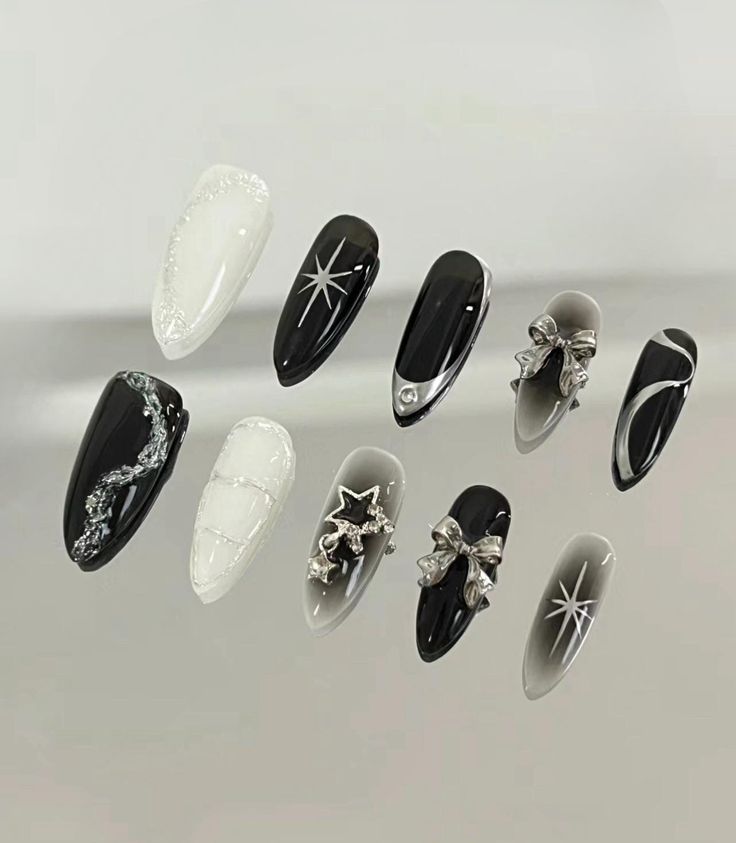 Chic Black-and-White Nail Design with Intricate Textures and Sophisticated Details