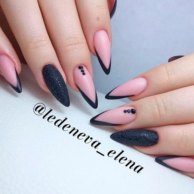 Chic Almond-Shaped Nail Design: Matte Black and Soft Pink with Sophisticated Accents.