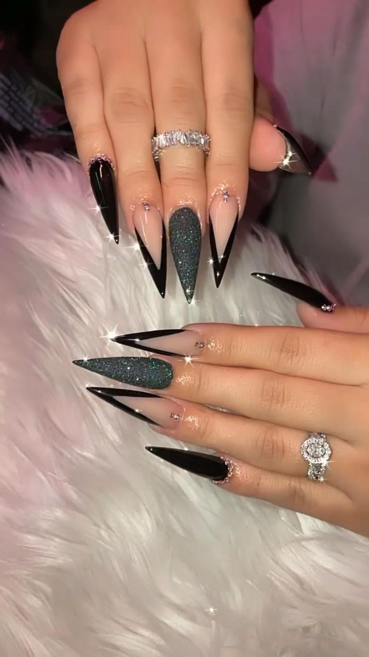 Elegant Stiletto Nail Design with Black Glitter Gradient and Rhinestones