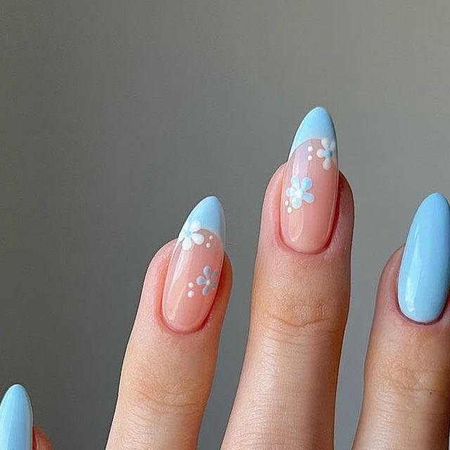 Elegant Spring Nail Design: Soft Pastel Blue Tips and Nude Base with Floral Patterns