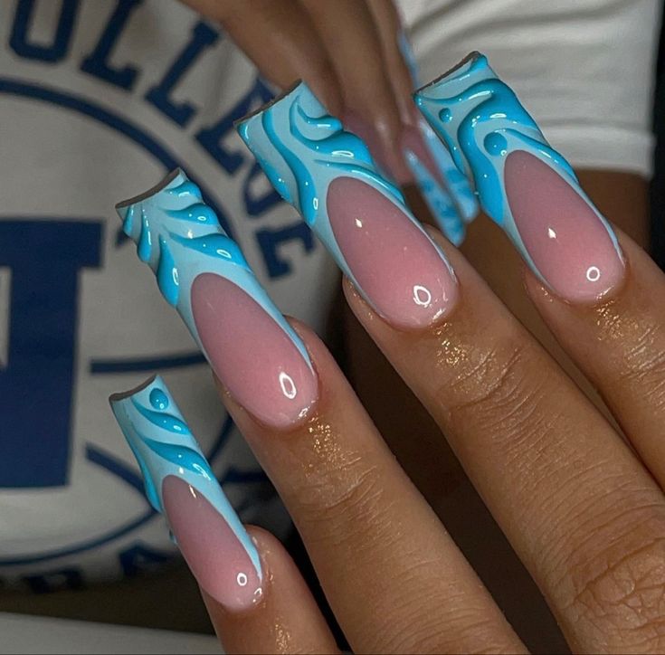 Whimsical Nail Art: Elongated Shapes with Soft Pink and Vibrant Blue Hues