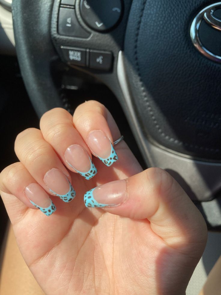 Chic Light Blue French Tip Nails with Trendy Black Spot Accents