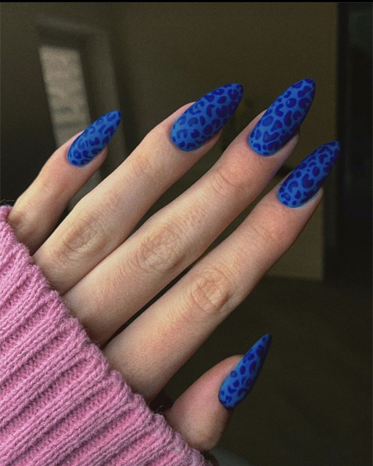 Bold Blue Leopard Print Nails: Glossy and Elongated for an Adventurous Look.