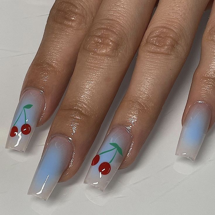 Elegant Cherry-Themed Nail Design with Soft Blue Gradient and Playful Fruity Accents.