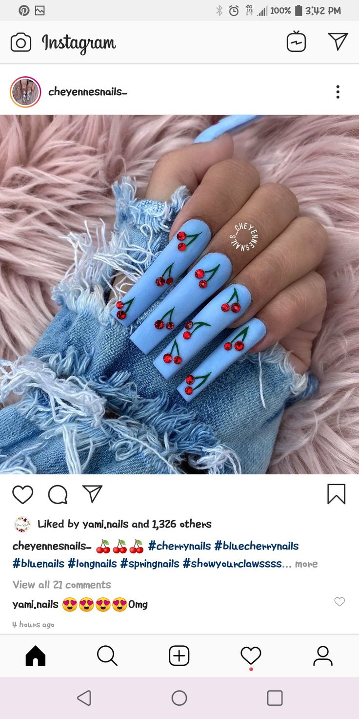 Charming Blue Nail Design with Playful Cherry Motifs for a Fresh Spring Look.