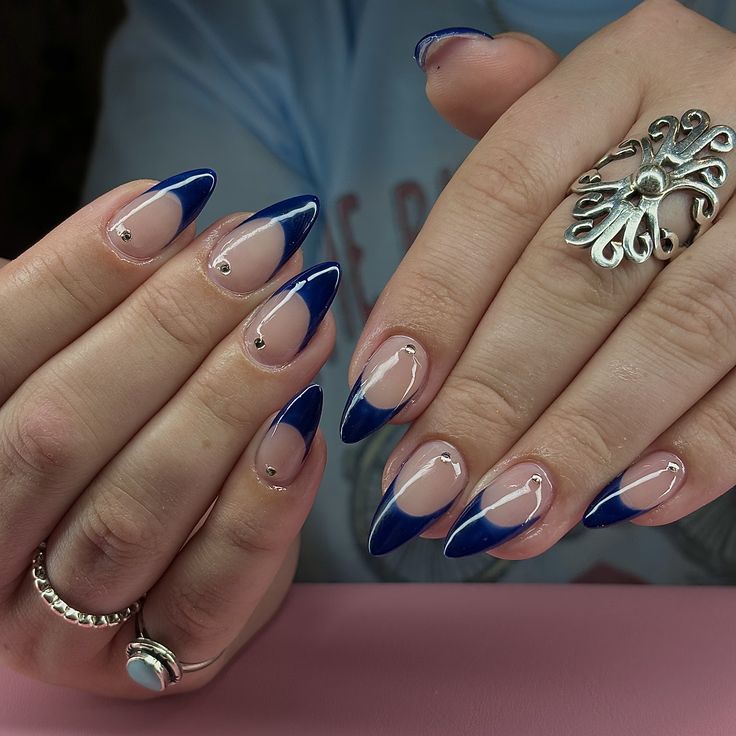 Chic Stiletto Nails with Striking Blue Tips and Silver Accents