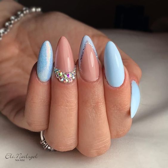 Elegant Pastel Almond Nail Design with Rhinestones and Silver Accents