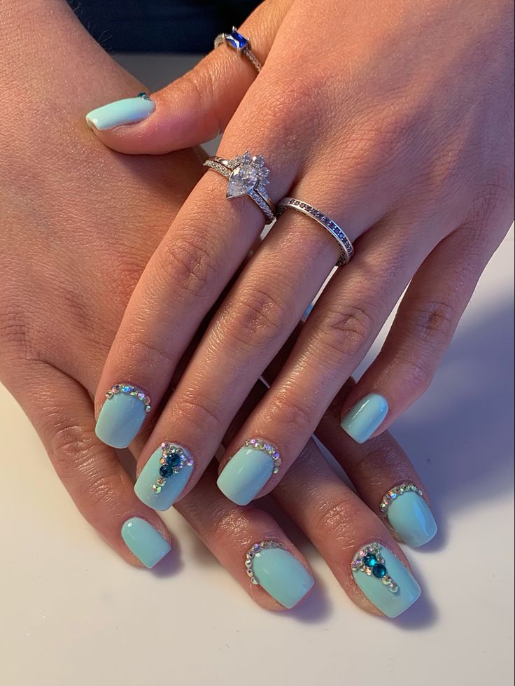 Elegant Mint Green Nails with Sparkling Embellishments: A Perfect Blend of Sophistication and Playfulness.