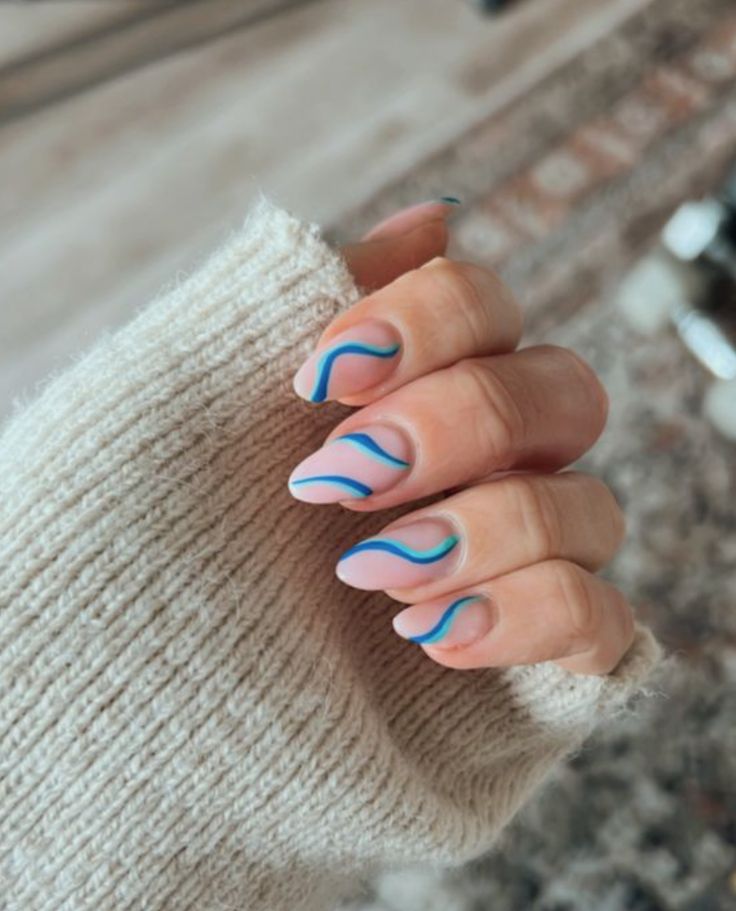 Chic Pastel Nail Design with Fluid Wave Patterns in Vibrant Contrasts