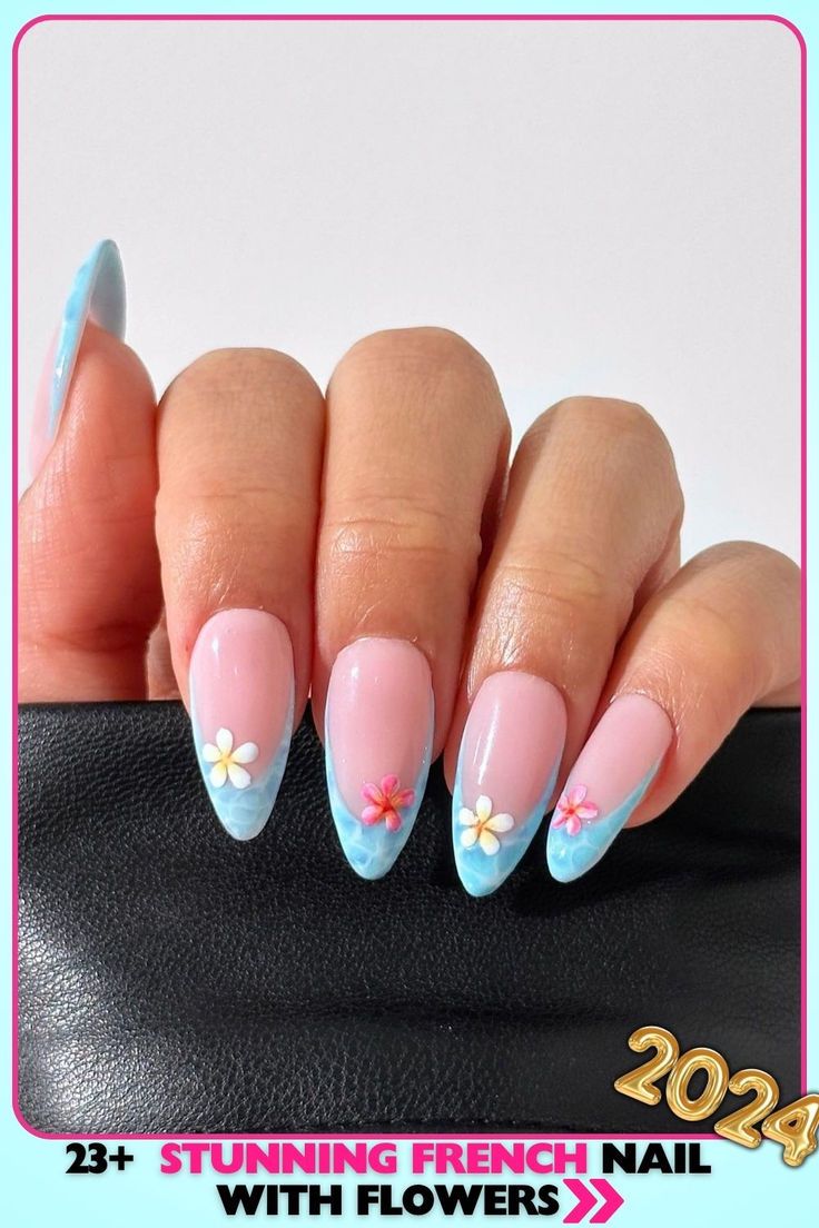 Delicate Pastel French Manicure with Floral Accents and Soft Blue Tips.