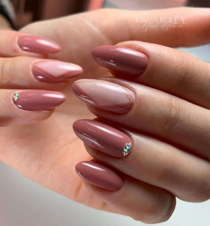 Elegant Almond-Shaped Nails with Soft Pink and Deep Mauve, Featuring Geometric Design and Sparkling Rhinestones.