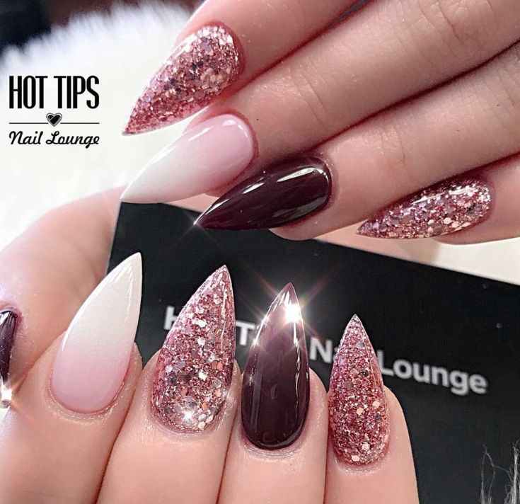 Chic Nail Design: Elegant Shapes and Gleaming Glitter Accents in Maroon and White.