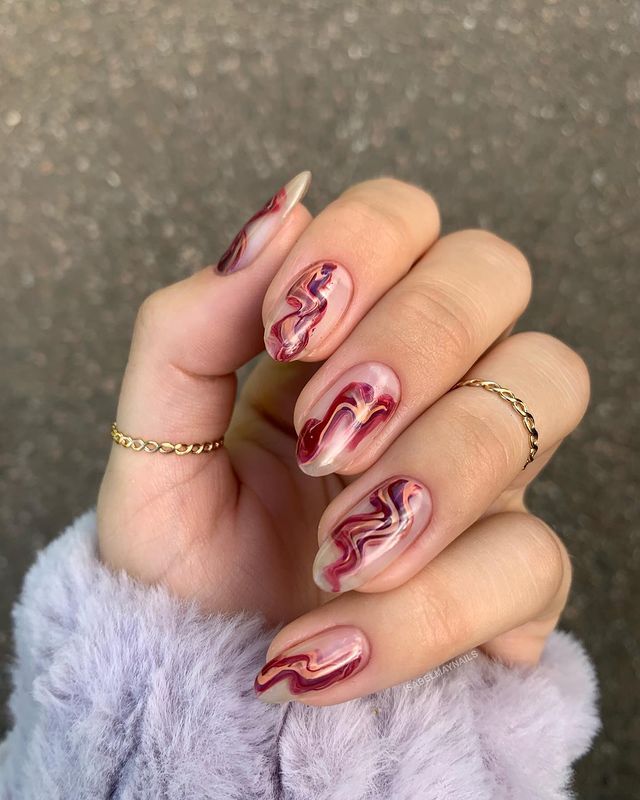 Elegant Burgundy and Pink Marble Swirl Nail Design with Glossy Finish and Gold Accents