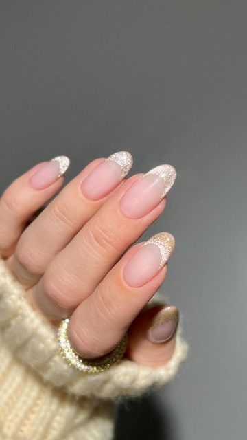 Chic French Manicure: Soft Nude Base with Sparkling Glitter Tips for a Sophisticated Look