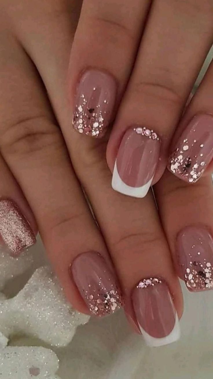 Chic Soft Pink Glitter French Manicure with Rose Gold Accents.