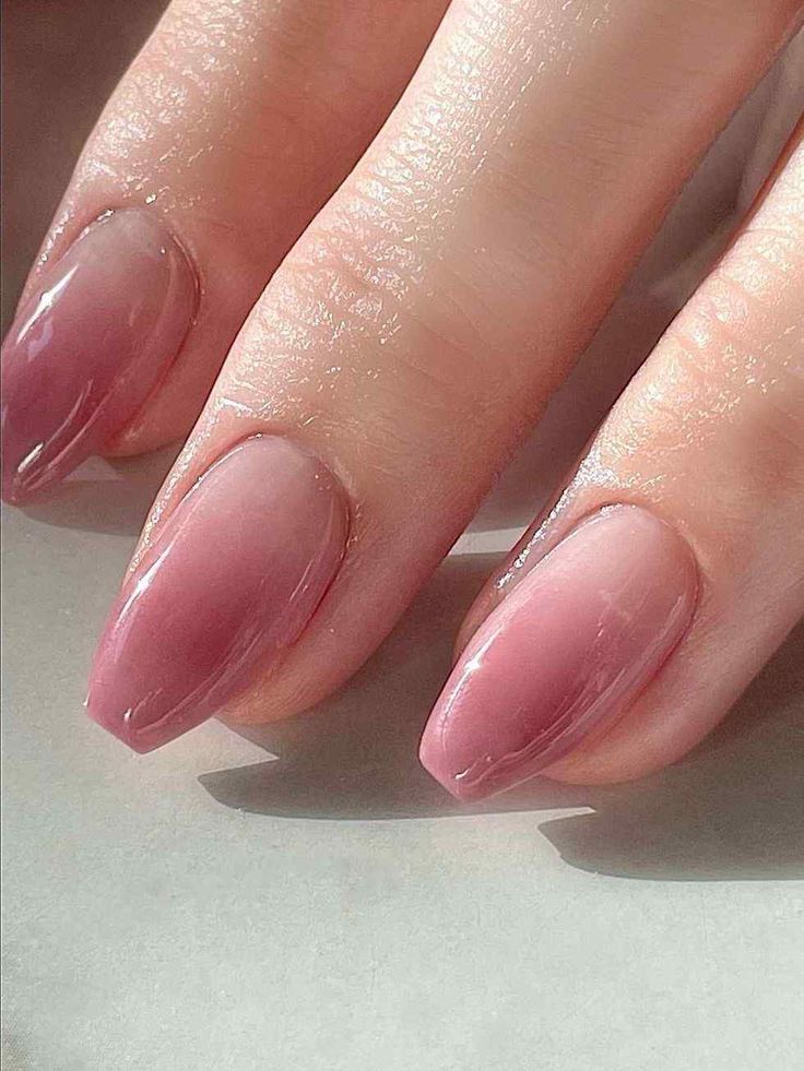 Elegant Ombre Nail Design with Subtle Nude to Rich Rosy Pink Gradient.