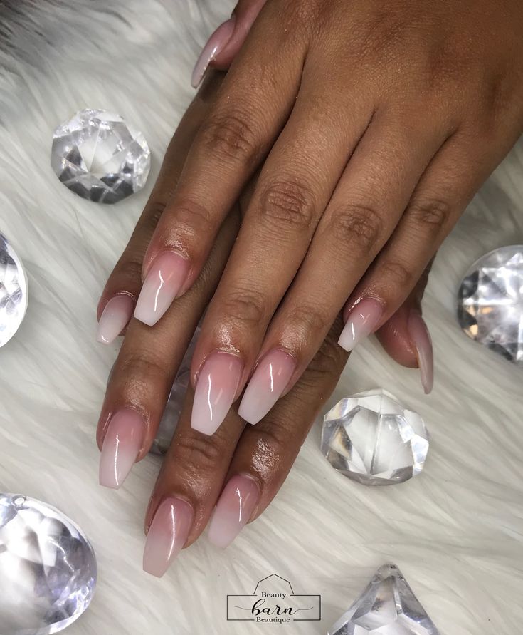 Chic Ombre Nail Design with Soft Pink Shades and Gemstone Accents.