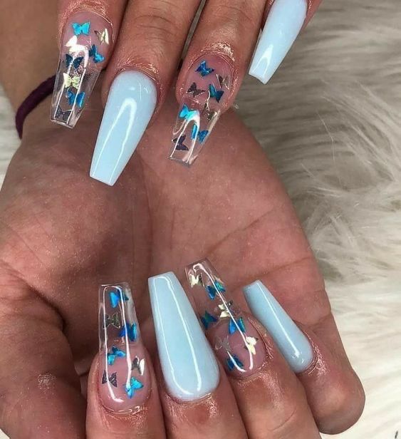 Whimsical Soft Blue Nail Design with Clear Accents and Shimmering Confetti