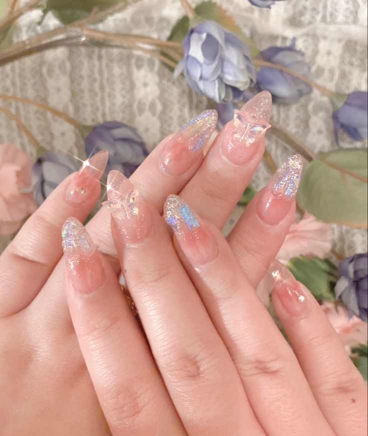 Whimsical Tapered Nail Design with Pastel Colors and Glittery Butterfly Accents.