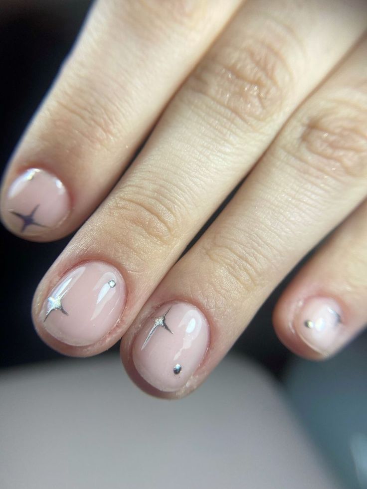 Chic Minimalist Nail Design with Nude Base and Sparkling Silver Accents