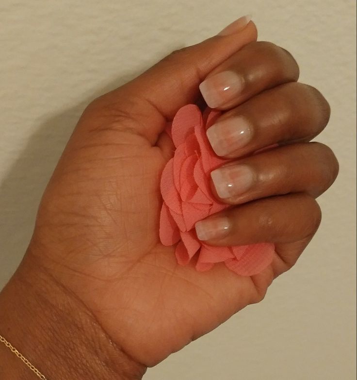 Elegant Ombre Nails with Coral Flower Accent for a Polished Look