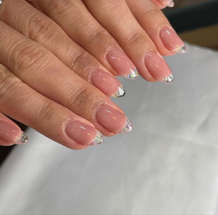 Glamorous Nude Nail Design with Shimmering Silver Accents for Any Occasion.