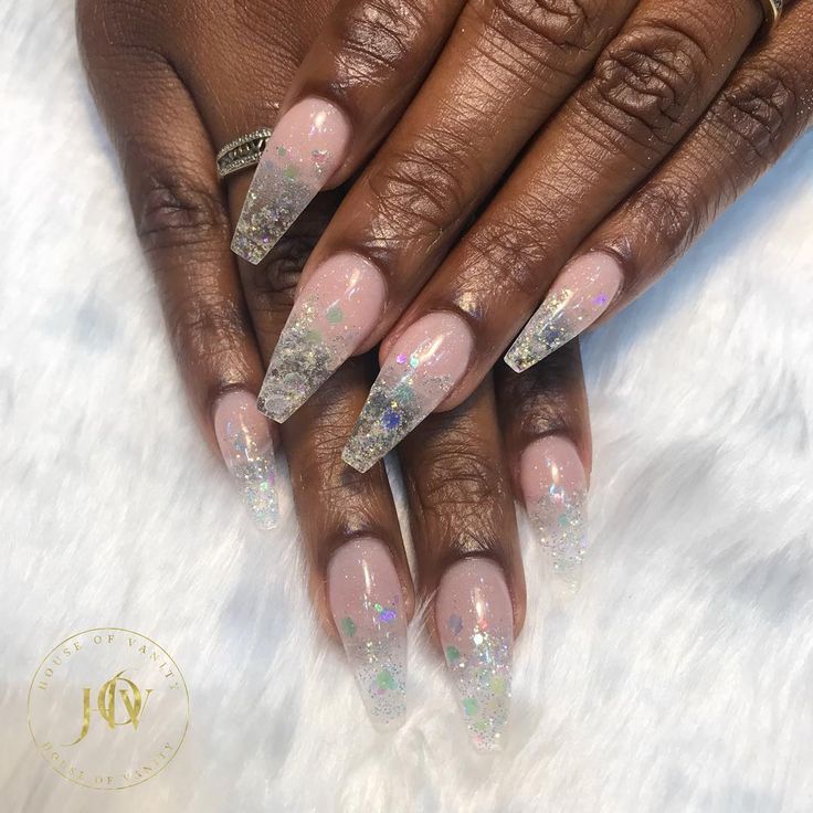 Whimsical Elegance: Nude Stiletto Nails with Glittery Tips and Stars