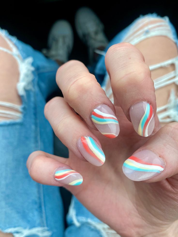 Playful Pastel Stripes on Transparent Base: A Fresh Nail Art Design.