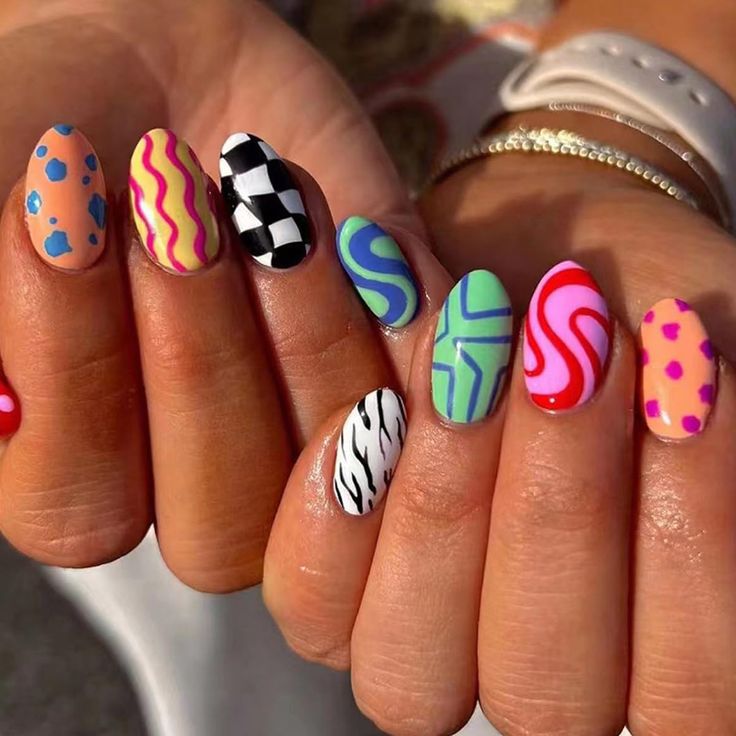 Vibrant Eclectic Nail Design with Unique Patterns and Textures