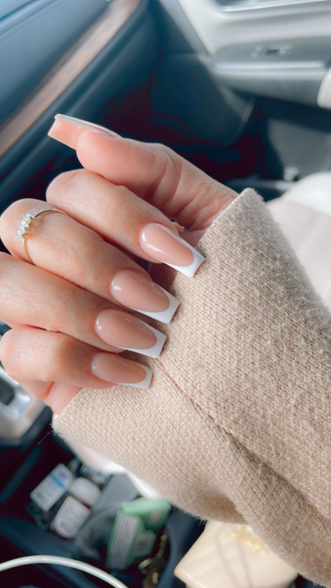 Sophisticated Nude and White Ombre Nails: A Modern Aesthetic Statement.