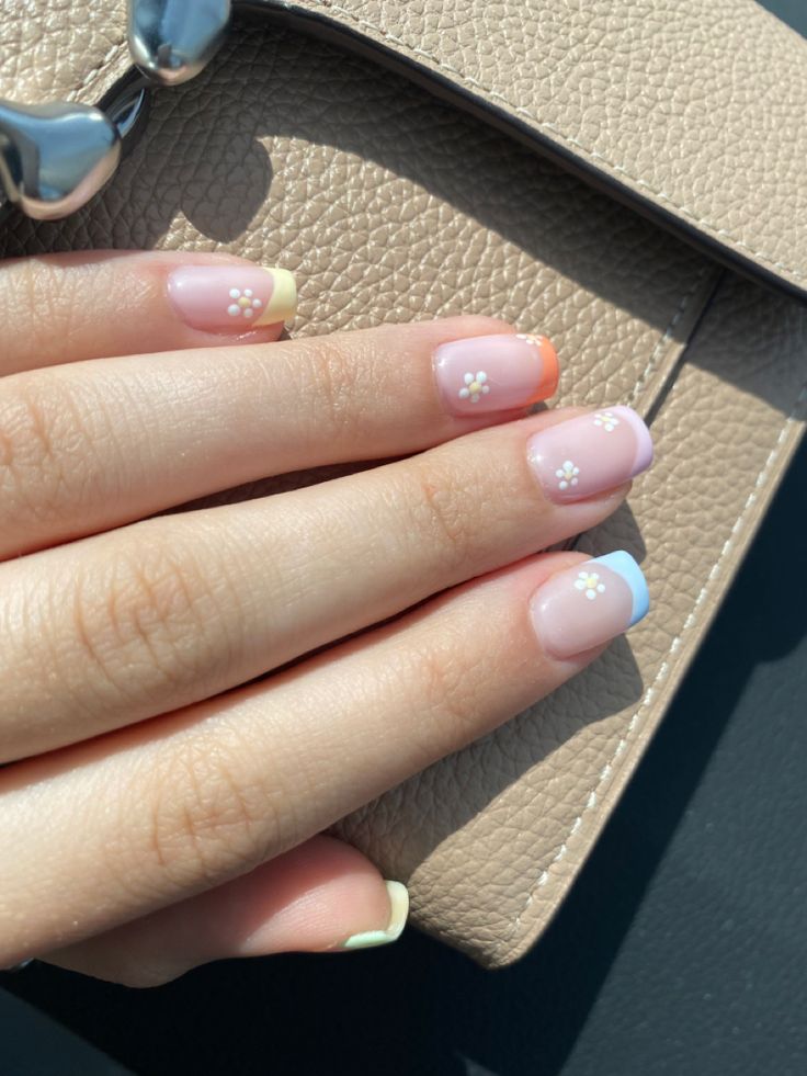 Pastel Floral Nail Design with Vibrant Tips and Delicate Accents.