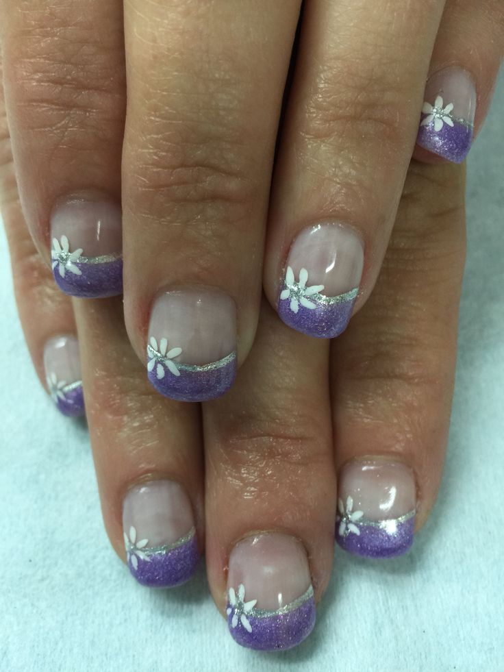 Soft Purple Gradient Nail Design with Floral Accents and Sparkling Silver Lines for a Fresh Feminine Look.