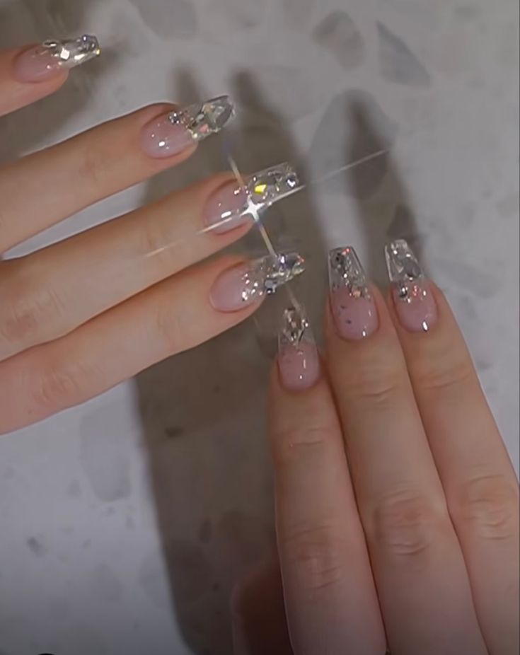 Chic Pink Nail Design with Crystals and Geometric Accents for Glamorous Appeal.