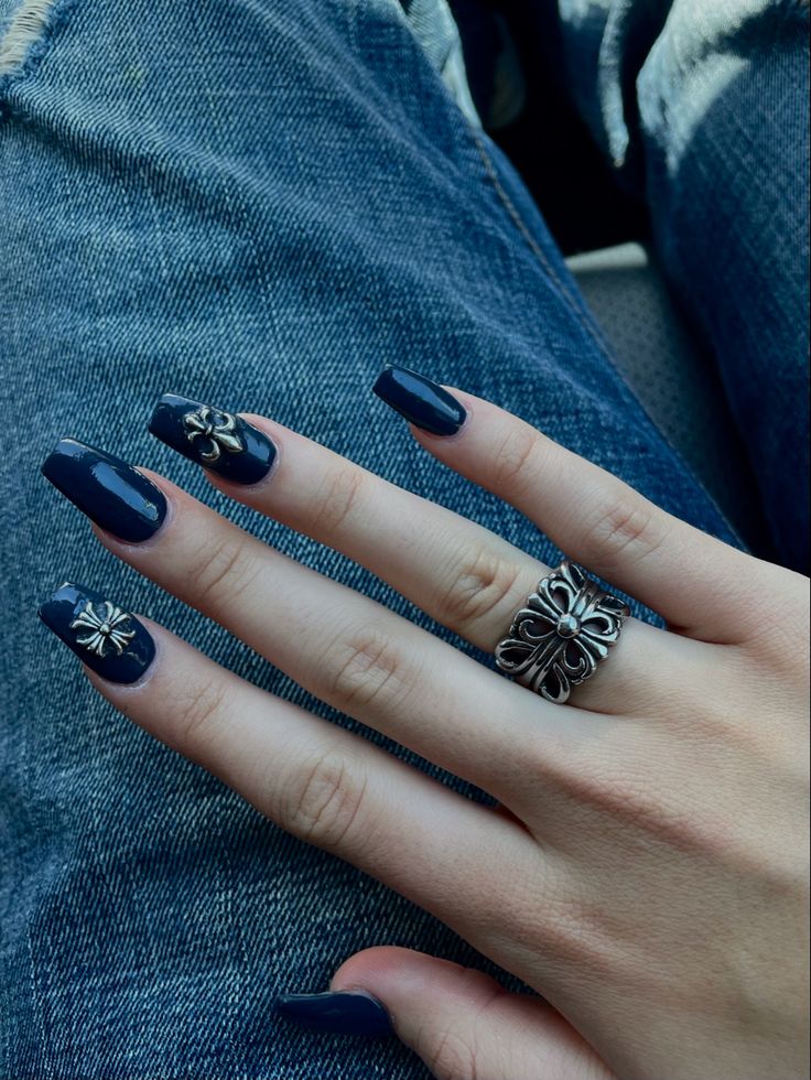 Chic Dark Navy Nails with Glossy Finish and Elegant Silver Flower Designs.