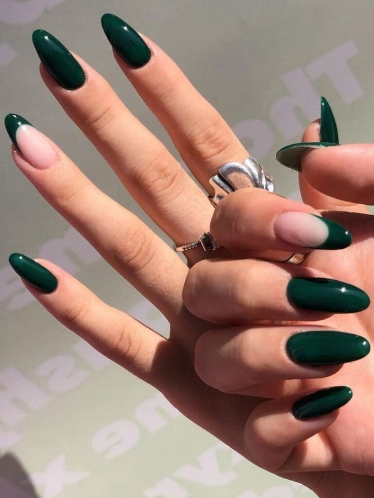 Sophisticated Almond-Shaped Nail Design in Dark Green and Soft Nude.