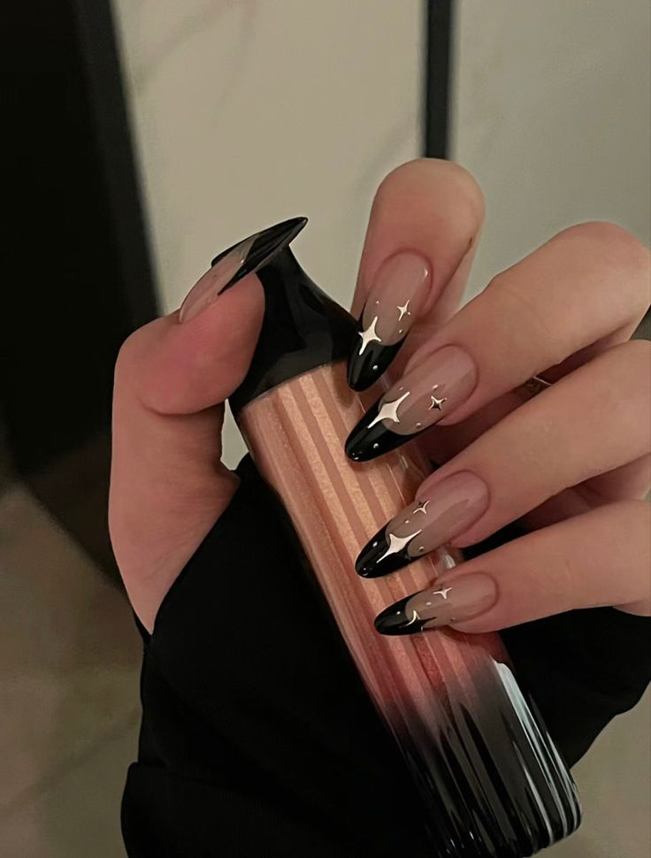 Elegant Ombre Nail Design with Star Accents and Trendy Hand-held Accessories