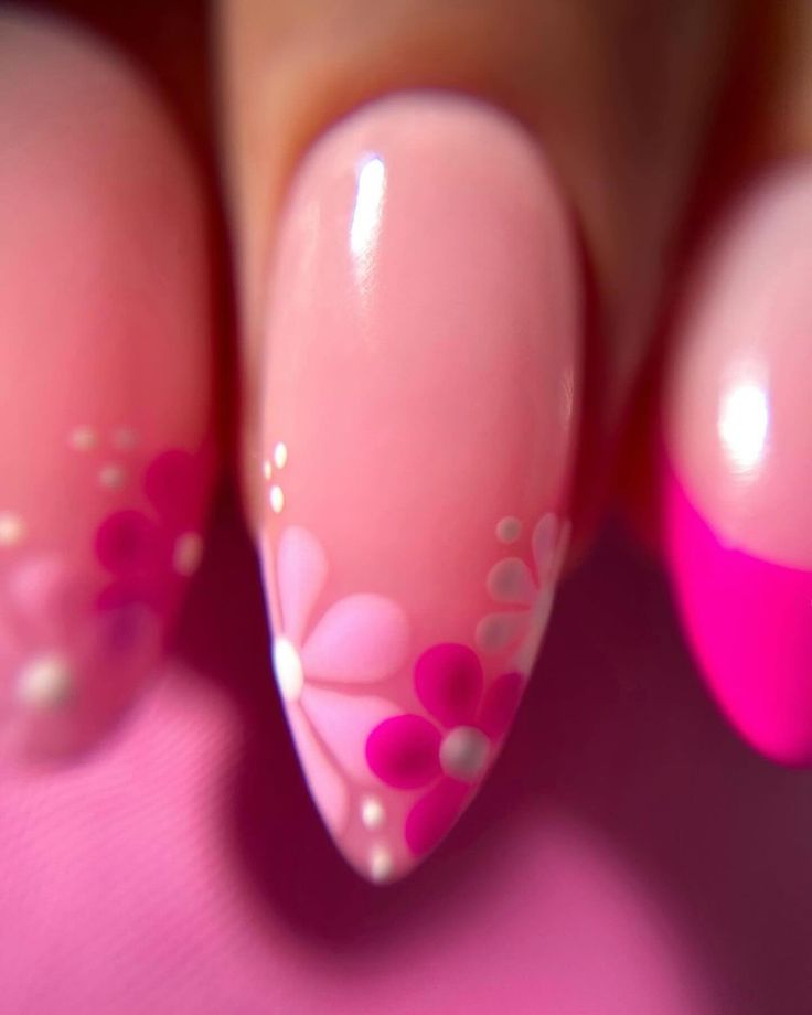 Elegant Floral Nail Design with Soft Pink Background and Glossy Finish for Spring/Summer.