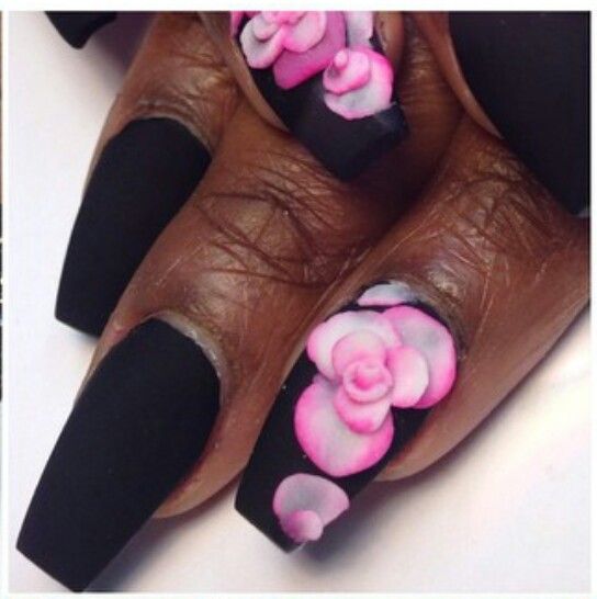 Bold Three-Dimensional Pink Floral Nail Art on Matte Black Base.