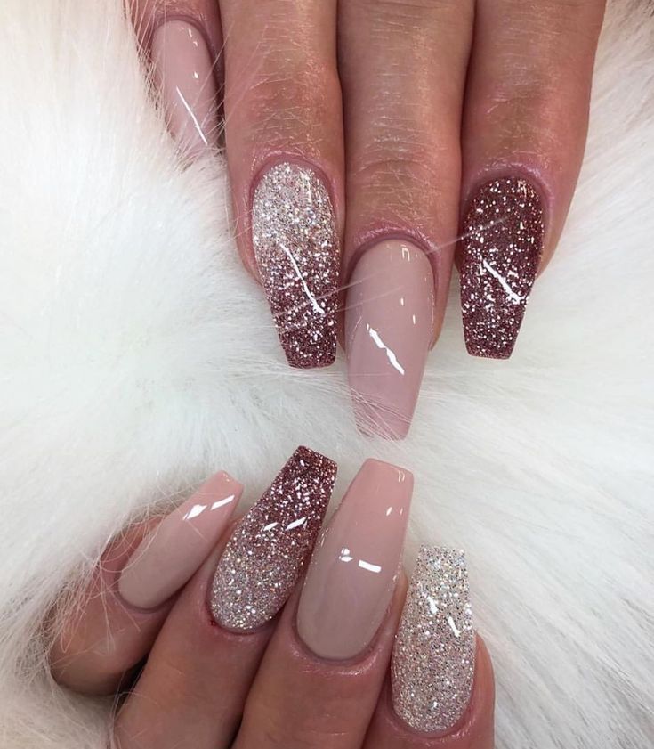 Elegant Nude Nail Design with Glamorous Glitter Accents.