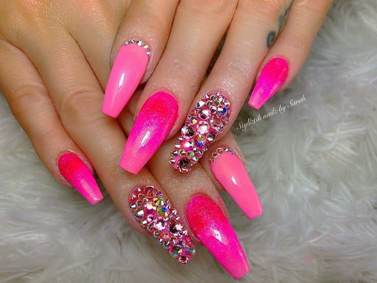 Vibrant Pink Nail Design: A Striking Blend of Glossy Finishes and Colorful Rhinestones