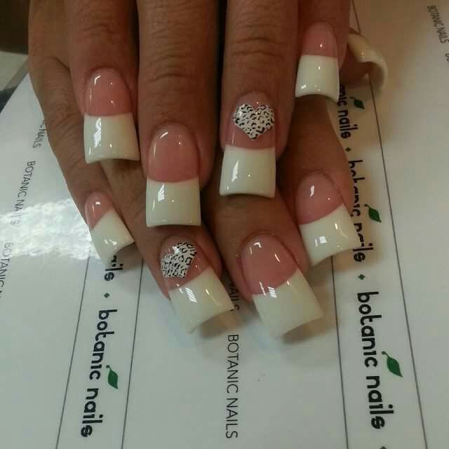 Sophisticated Elegant French Tip Nails with Playful Heart Design.