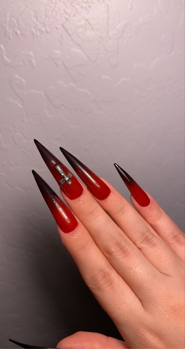 Bold Gradient Pointed Acrylic Nails: Deep Red to Black with Glossy Finish and Silver Accents.