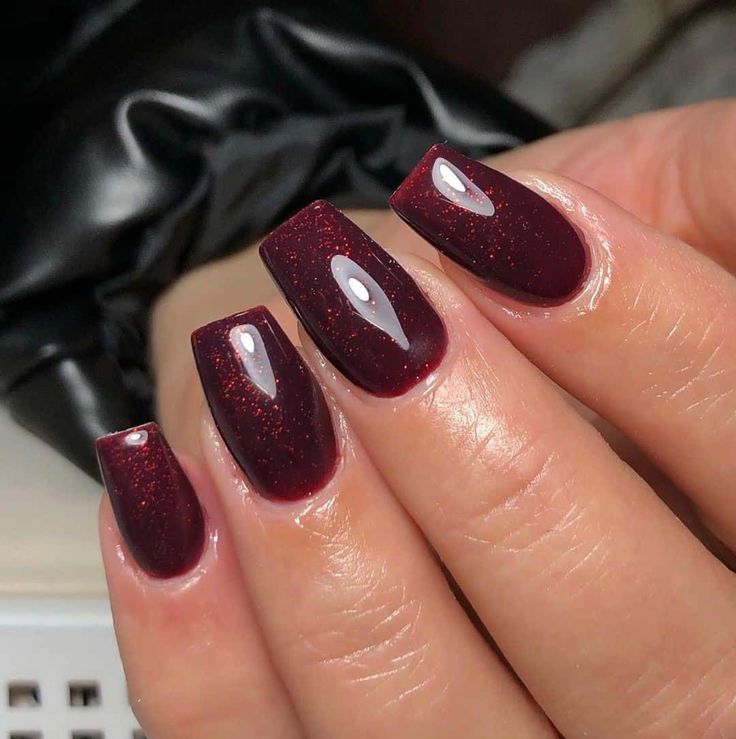 Sophisticated Burgundy Nails with Shimmering Finish and Glossy White Accents.