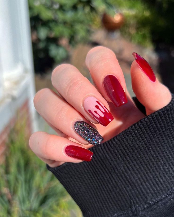 Elegant Deep Red and Playful Pink Nail Design with Glittery Accents and Whimsical Dripping Effect.