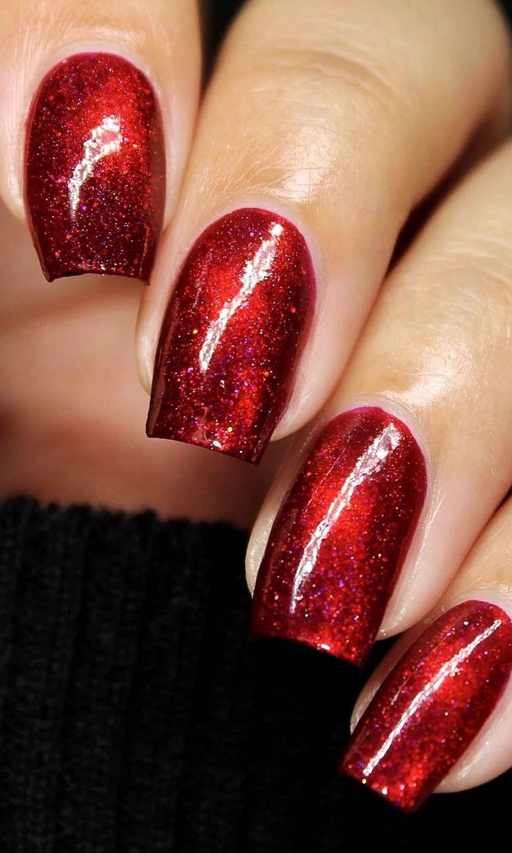 Captivating Sparkling Red Nail Design for Festive Glamour.