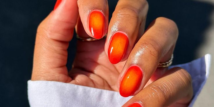 Vibrant Orange Gradient Nail Design: A Perfect Summer Look.