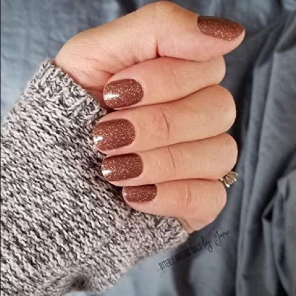 Elegant Brown Glitter Nail Design Perfectly Paired with a Cozy Sweater.