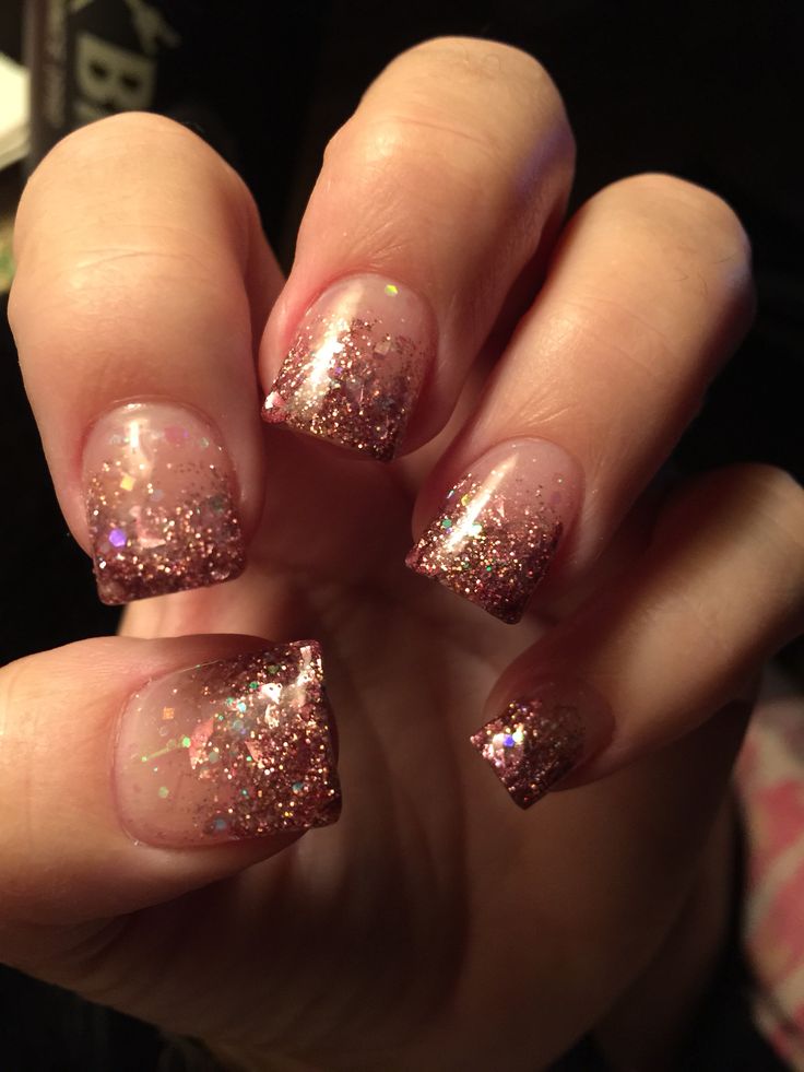 Glamorous Glittery Ombre Nails with Polished Nude Base and Sparkling Rose Gold Tips.