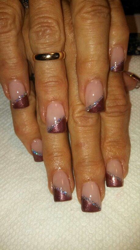 Chic Gradient Nail Design with Nude, Burgundy, and Silver Glitter Accents.