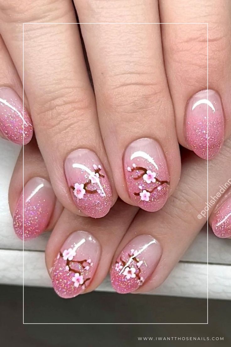 Elegant Cherry Blossom Ombre Nail Design with Hand-Painted Flowers and Subtle Glitter.